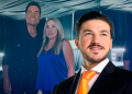 Samuel-garcia-presumio-concierto-de-chayanne › Regiadísticas Man in a Suit with an Orange Tie Smiles in the Foreground at a Social Event, with Two Casually Dressed Guests Behind Him in Blue and Black. › Regiadísticas